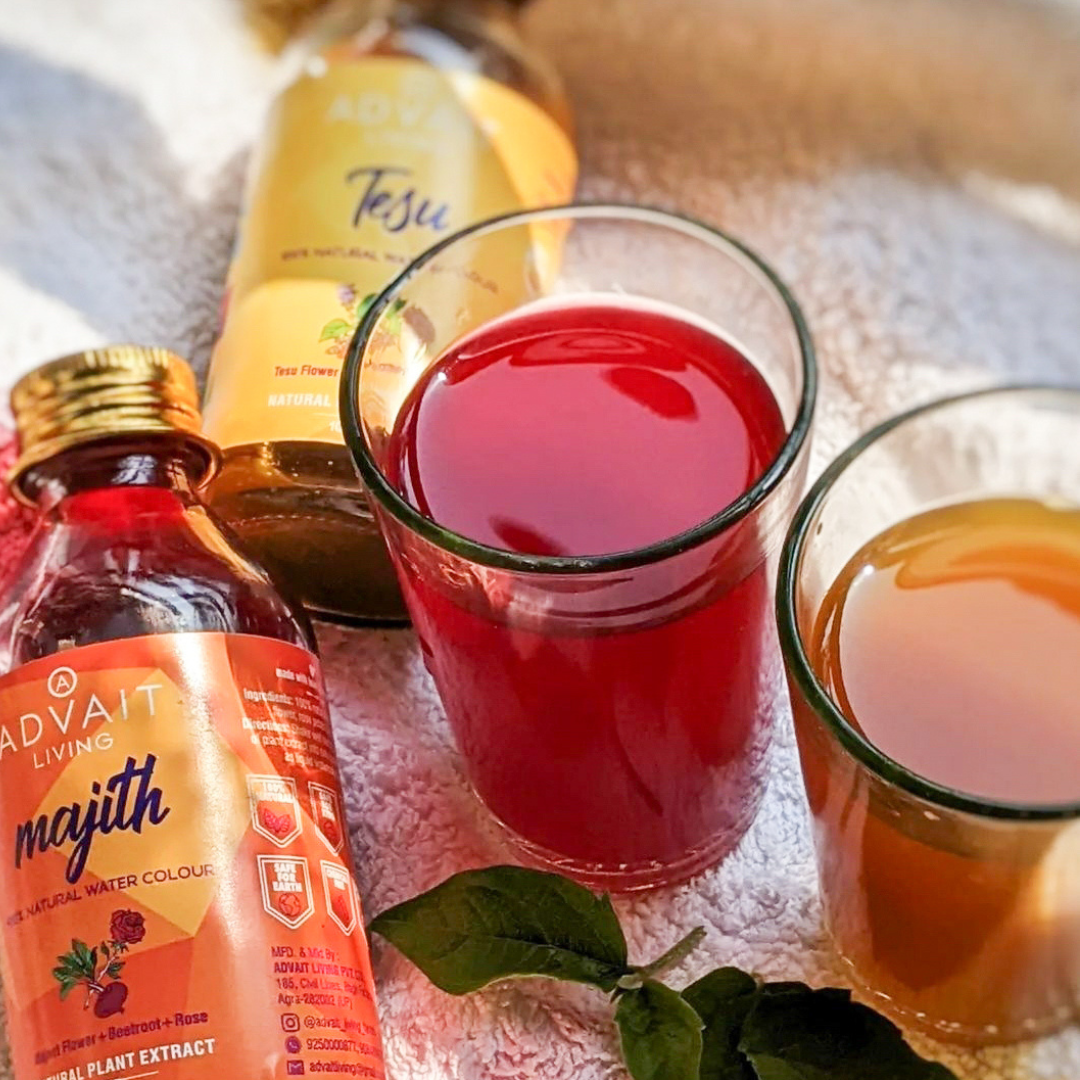 Two glasses with Majith and Tesu water colours on table