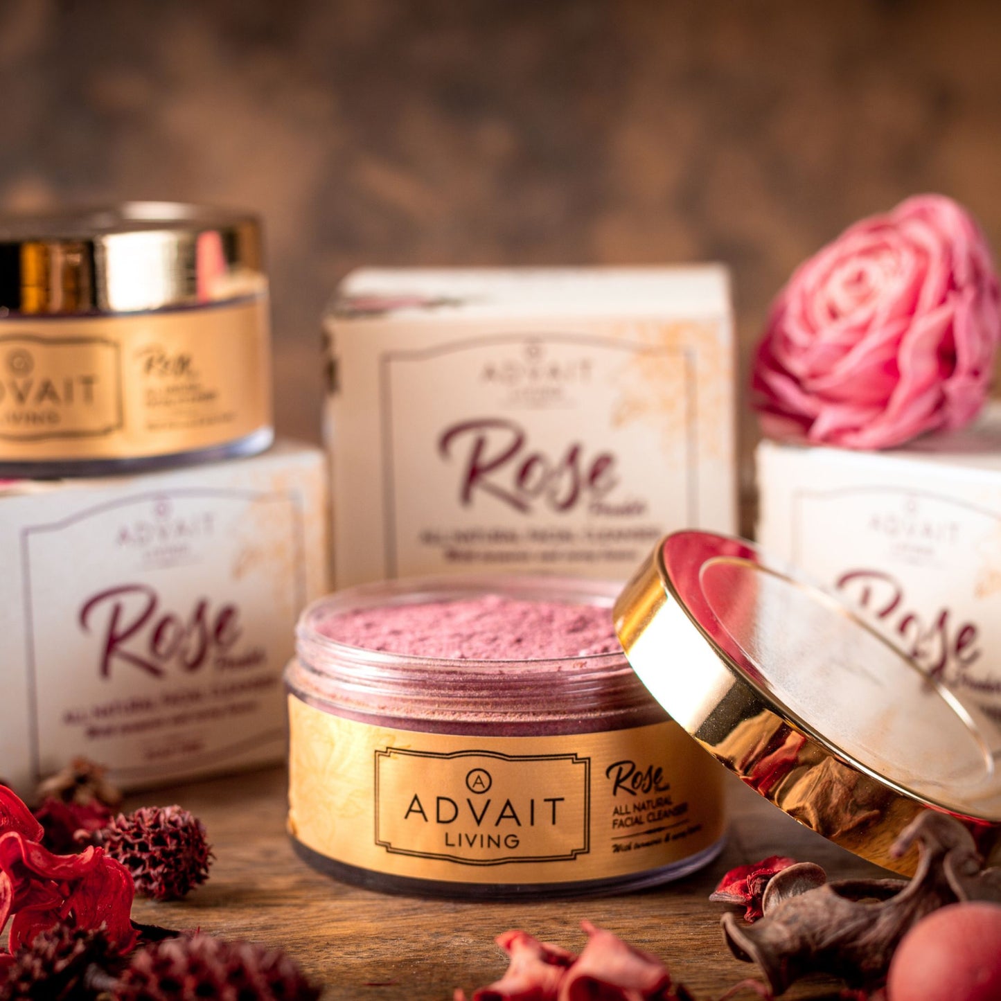 open container with rose powder and 3 boxes in the background