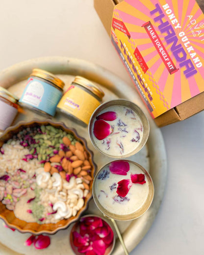 A plate with 2 glasses of freshly prepared thandai using Advait Living Unsweetened Thandai Powder