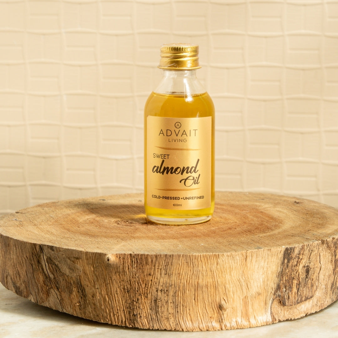 100 ml glass bottle of Advait Living Cold-Pressed Sweet Almond Oil