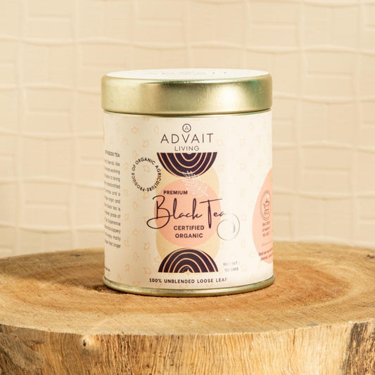 A 50 gm tin of Advait Living Premium Black Tea. Certified Organic, 100% Unblended Loose-Leaf Tea.